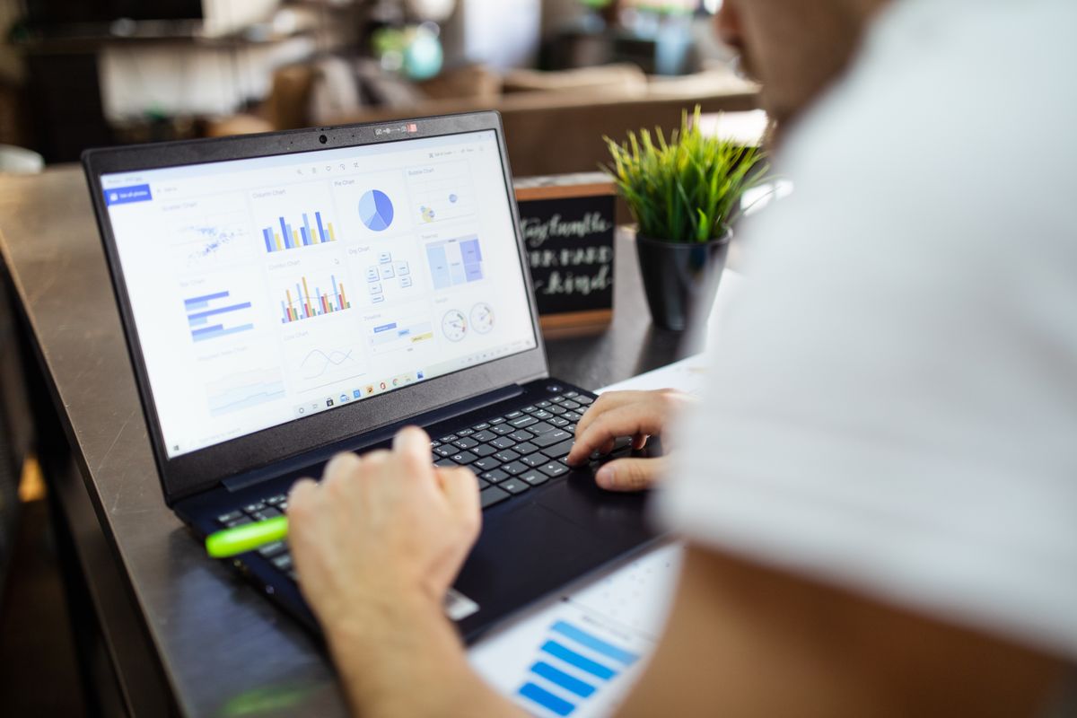 Laptop displaying economic reports